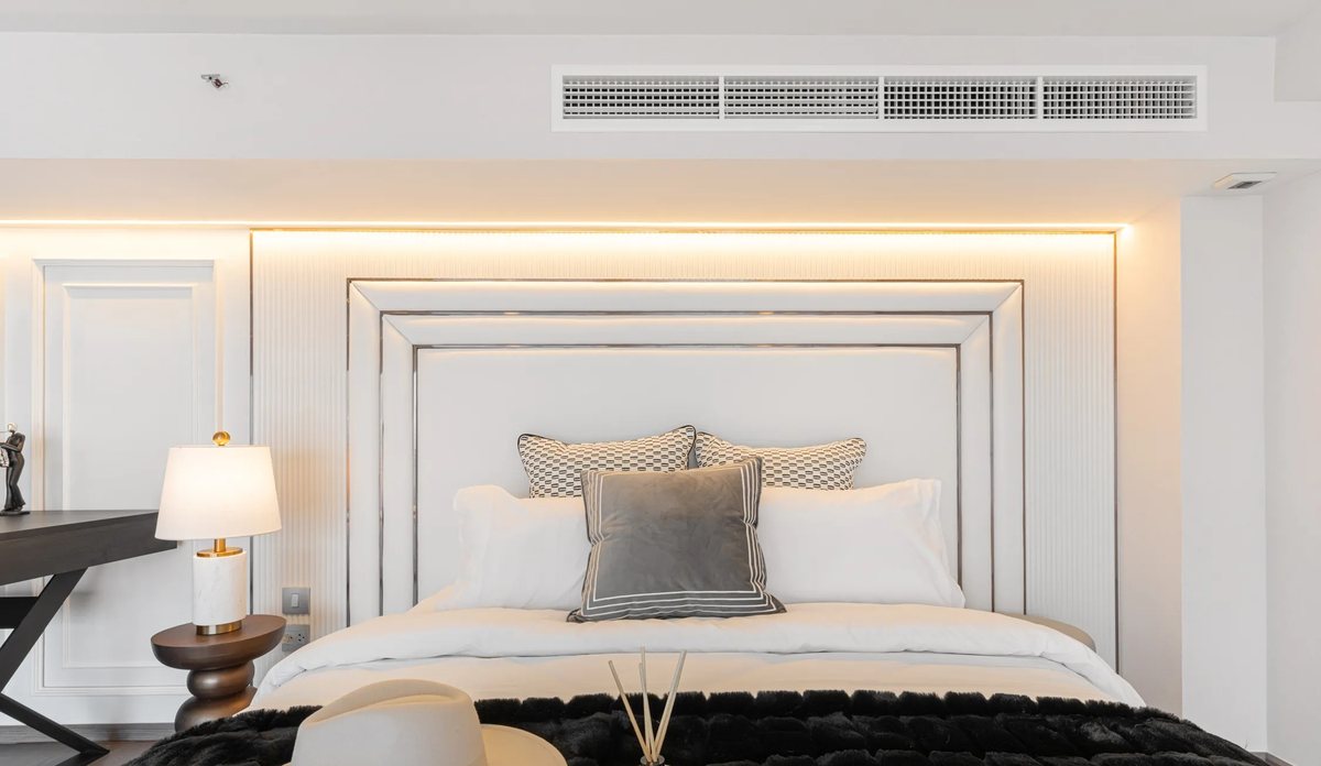 Bedroom with a designer headboard wall