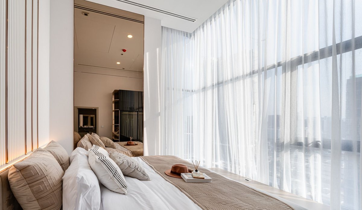 Bedroom with floor-to-ceiling curtains