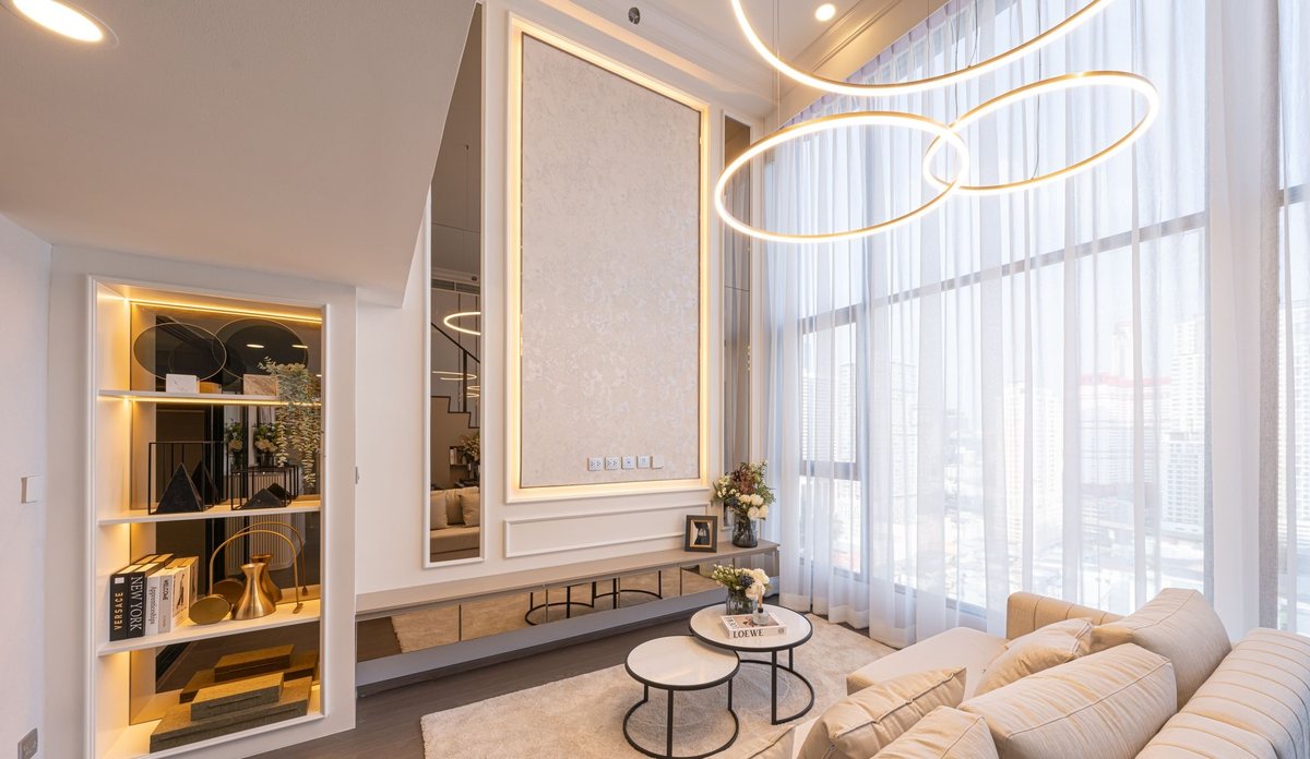 Living room with a chandelier and city views