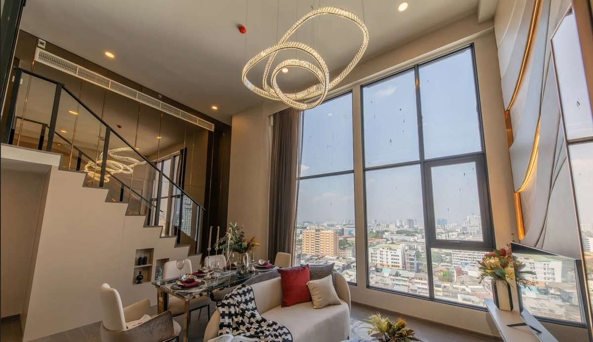Dining area and stairs in a high-floor unit